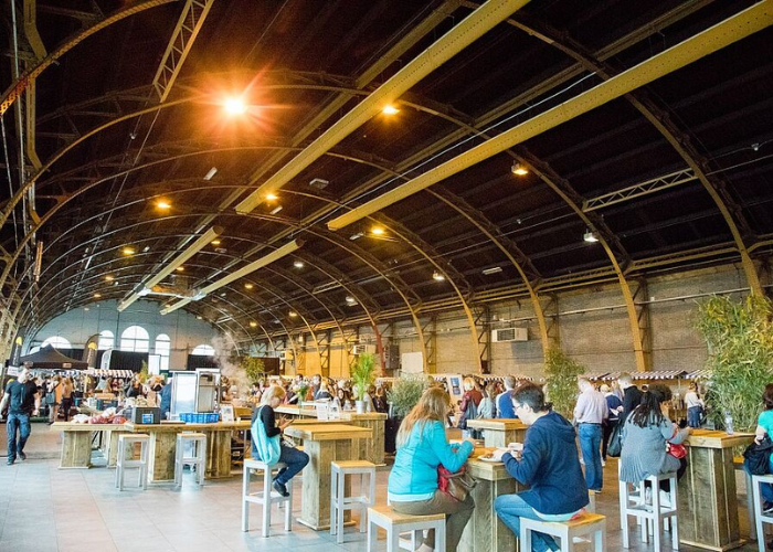 Visitors networking inside Tilburg’s industrial heritage venue.